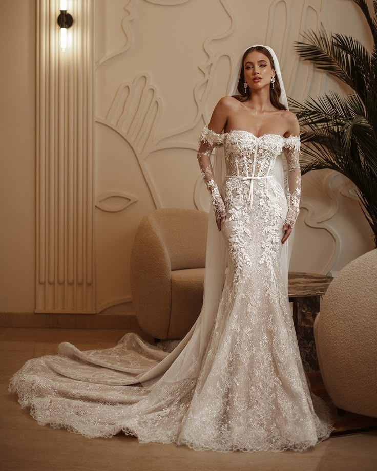 a woman in a wedding dress posing for the camera