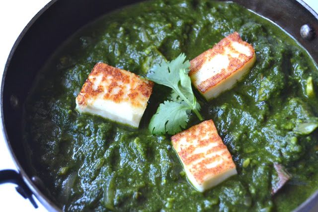 tofu and spinach in a green sauce with cilantro on the side