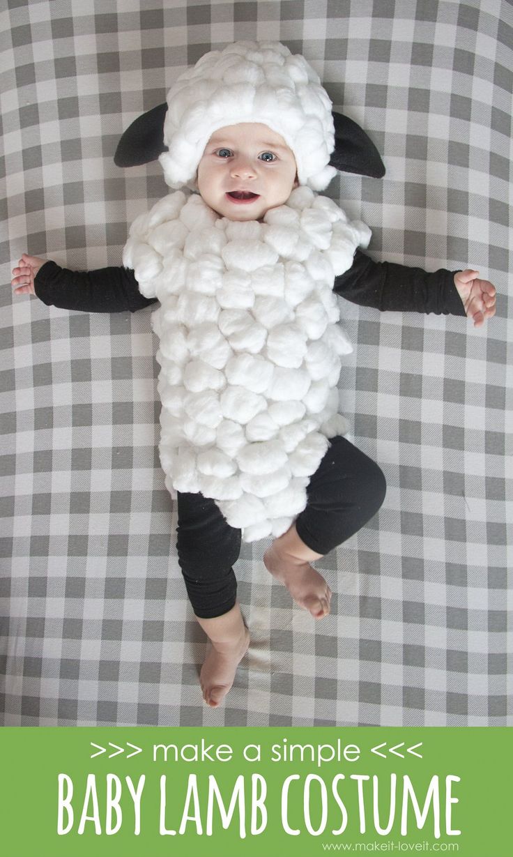 a baby wearing a sheep costume on top of a bed with text overlay that reads, make a simple baby lamb costume