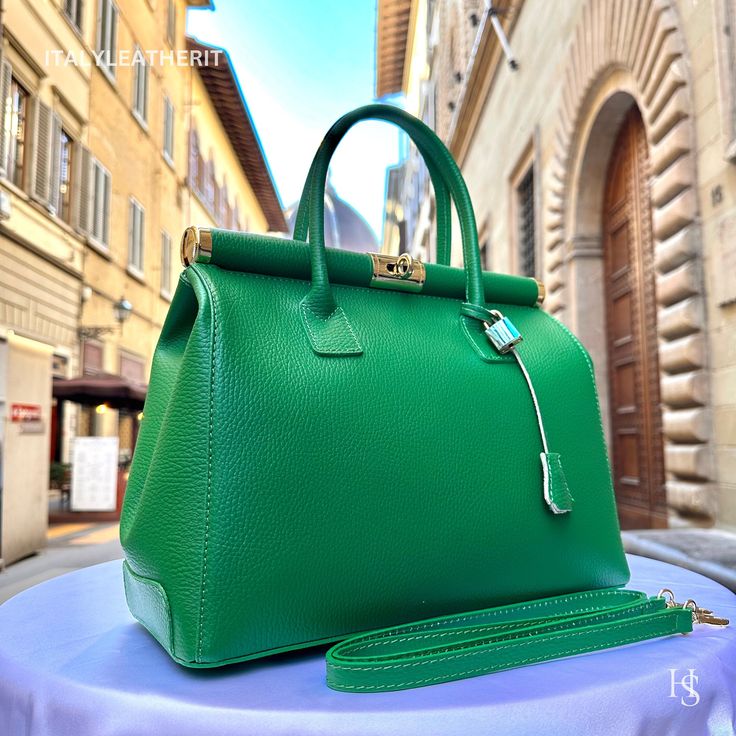 "This bag has been made of the best genuine leather by local master crafters of Florence in Italy, designed for women who only accept premium Italian quality and luxury leather bags and modern Italian fashion. . Size: Height: 28 cm/11.02 inches. Width: 33 cm/12.99 inches. Depth: 15 cm/ 5.91 inches. Color: Green . The story of this bag:  In the heart of Italy, where artistry and craftsmanship have flourished for centuries, a group of skilled artisans pours their passion into creating exquisite leather handbags. Among these masterpieces is \"The Florence Elegance,\" a handcrafted Italian leather bag that epitomizes style, grace, and practicality. This bag is more than just an accessory; it's a gift for her, a daily companion, and the perfect gift for Mom. It boasts the essence of Italian fas Luxury Green Briefcase For Daily Use, Luxury Green Satchel Briefcase, Luxury Green Bag For Business, Luxury Green Bag With Smooth Grain, Luxury Green Soft Leather Bag, Luxury Green Bag With Leather Lining, Luxury Green Satchel With Leather Handles, Luxury Green Smooth Grain Shoulder Bag, Luxury Green Satchel With Leather Lining