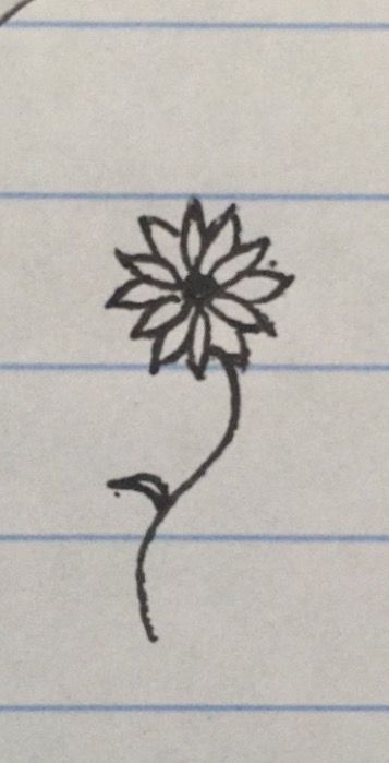 a drawing of a flower on lined paper