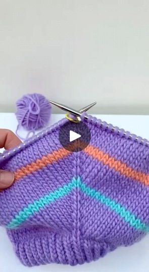 someone is crocheting something with yarn and scissors