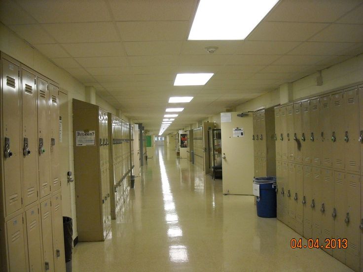 a long hallway with many lockers in it