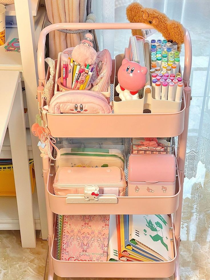 a pink cart filled with lots of different items