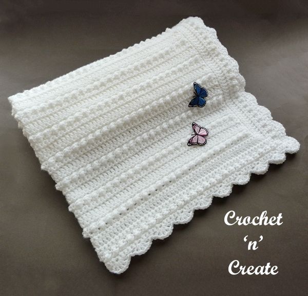 a crocheted dishcloth with two butterflies on it and the words crochet n'create written below