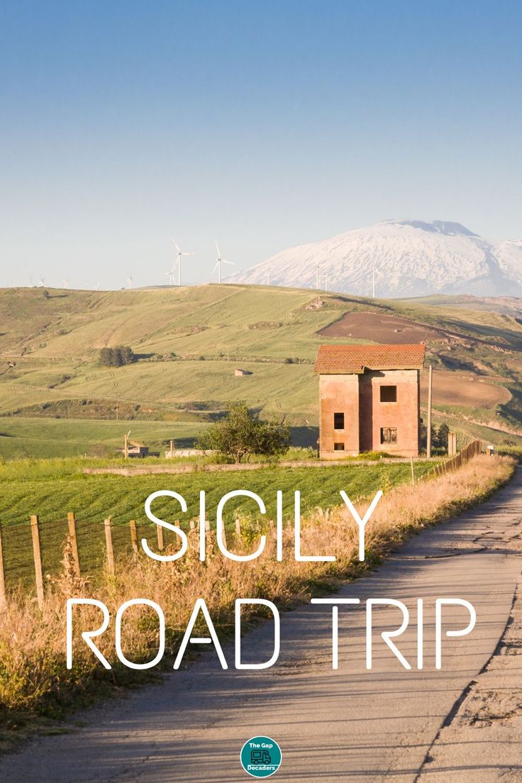 a road with the words siglyy road trip written on it in front of a rural landscape