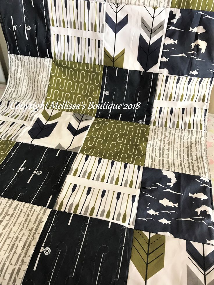 a quilt made with black, white and green fabric