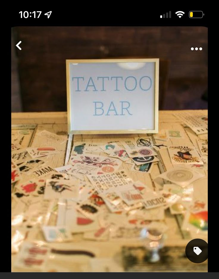 a table topped with lots of different types of tattoos