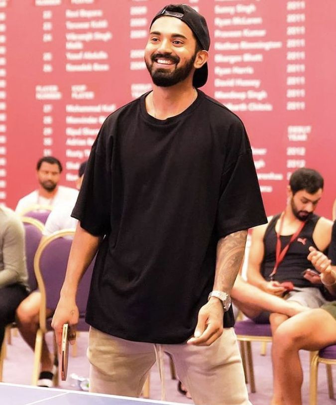 a man standing in front of a ping pong table