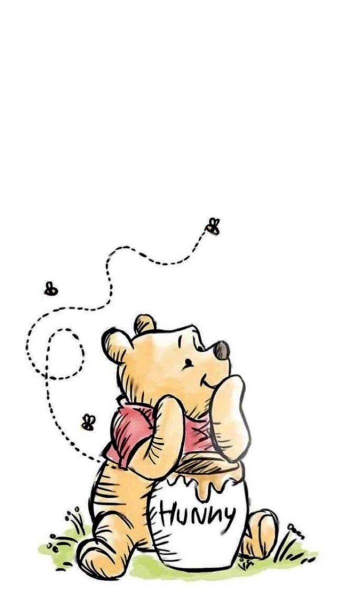 a winnie the pooh bear sitting on top of a ball with its paw in it's mouth