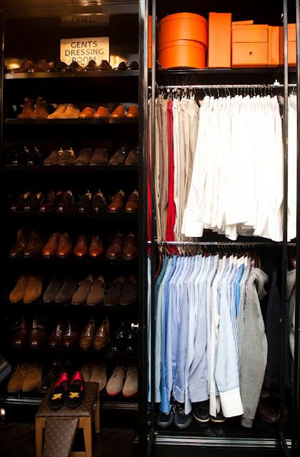 the closet is full of clothes and shoes