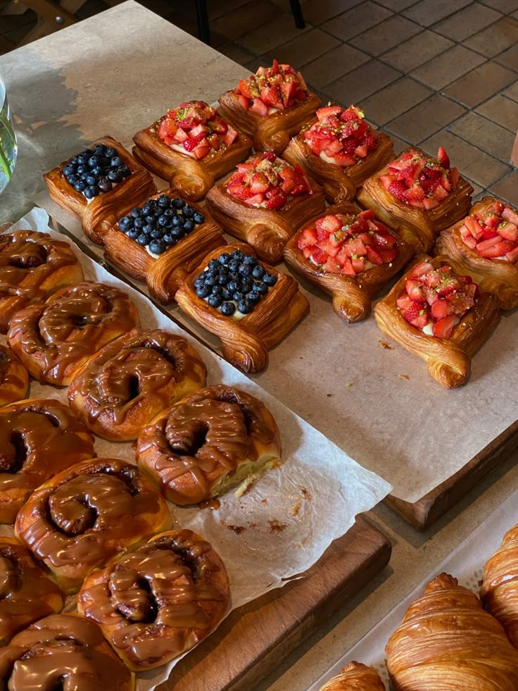 various pastries and desserts displayed on wooden trays