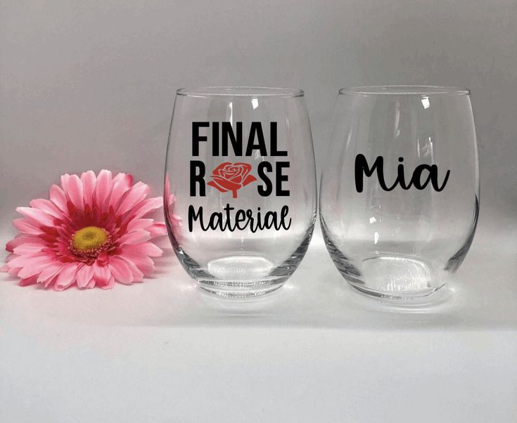 two wine glasses with the words final rose and mia on them next to a pink flower