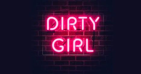 a neon sign that says dirty girl on it's side in front of a brick wall