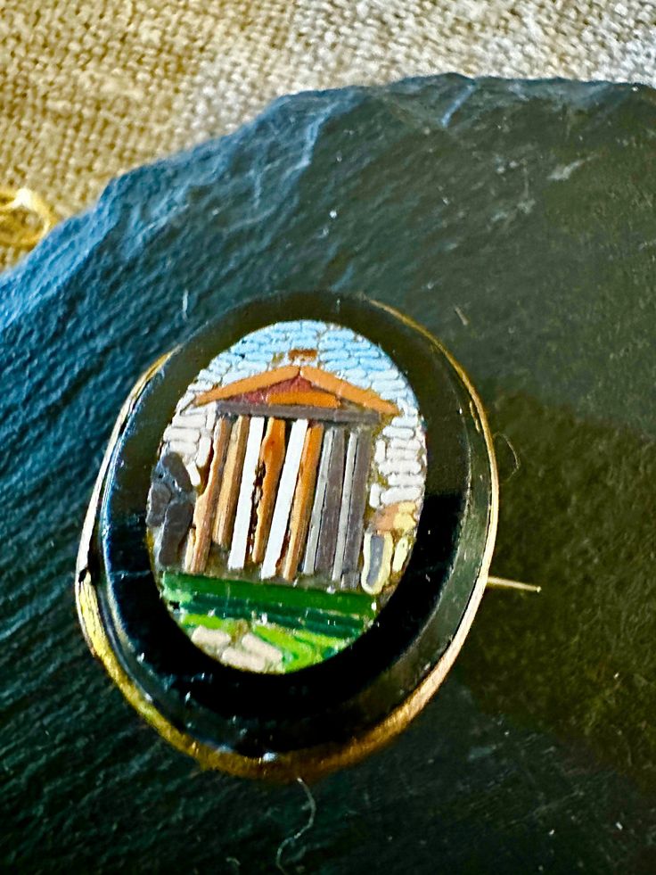 a close up of a button on a black surface