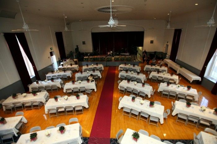 an empty banquet hall with tables and chairs