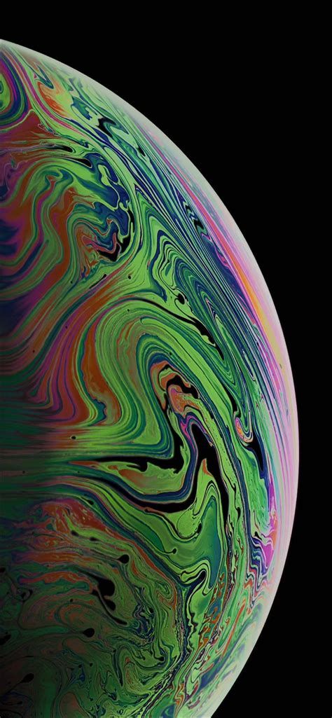 an iphone with colorful swirls on the back and side, in front of a black background