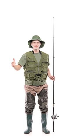 a man in waders holding a fishing pole and giving the thumbs up while standing against a white background