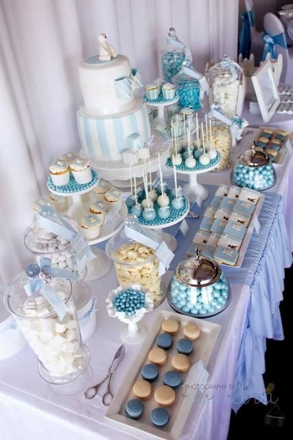 the dessert table is set up with cupcakes, cookies and other treats for a frozen princess birthday party