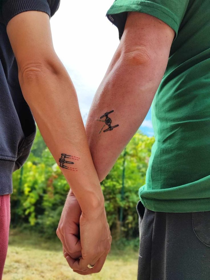 Star Wars tattoo 
Couple tattoo
X-wing, Tie Fighter tattoo
The Rebellion, The Empire
Light Side, Dark Side Star Wars Couple Tattoo Ideas, Marvel Couple Tattoos, Star Wars Couple Tattoo, Pair Tattoos, Star Wars Couples, Metz France, Small Couple Tattoos, Marvel Couples, Movie Tattoos