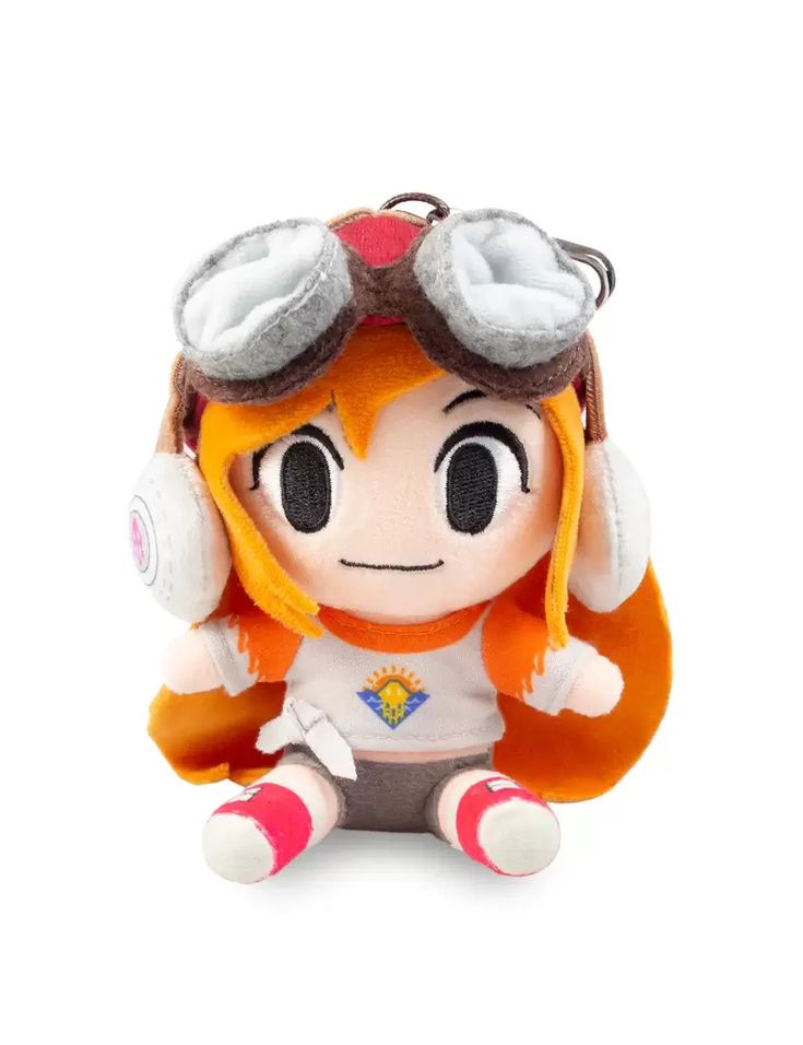 an orange and white stuffed animal with headphones on it's ears, sitting in front of a white background