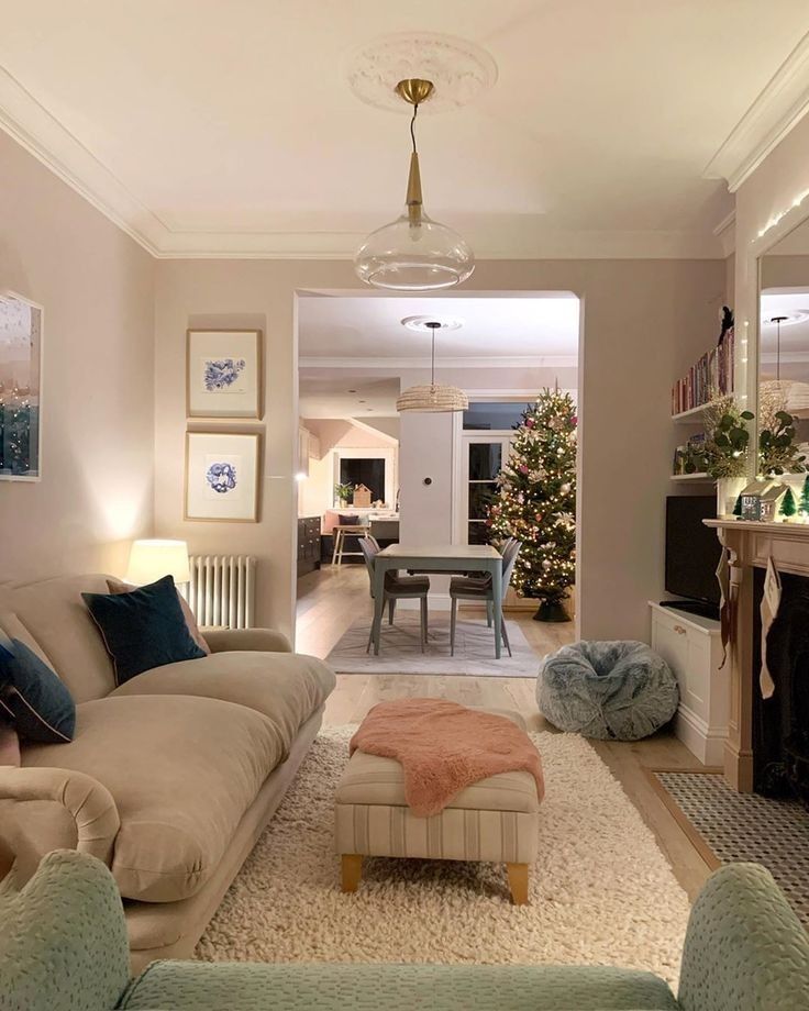 a living room filled with furniture and a fire place