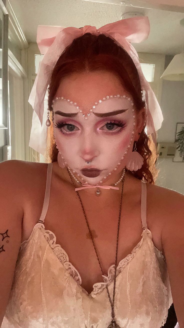 white base makeup pink editorial clown look coquette goth alternative blush pearl  bow aesthetic Coquette Clown Makeup, Girly Clown Makeup, Doll Clown Makeup, Valentine Clown Makeup, Clown Heart Makeup, Cute Doll Makeup Halloween, White Heart Makeup, Pastel Clown Makeup, Coquette Clown