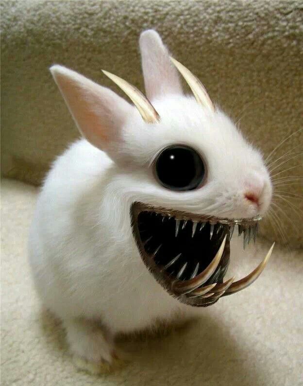 a small white rabbit with large metal spikes on its head and teeth in it's mouth