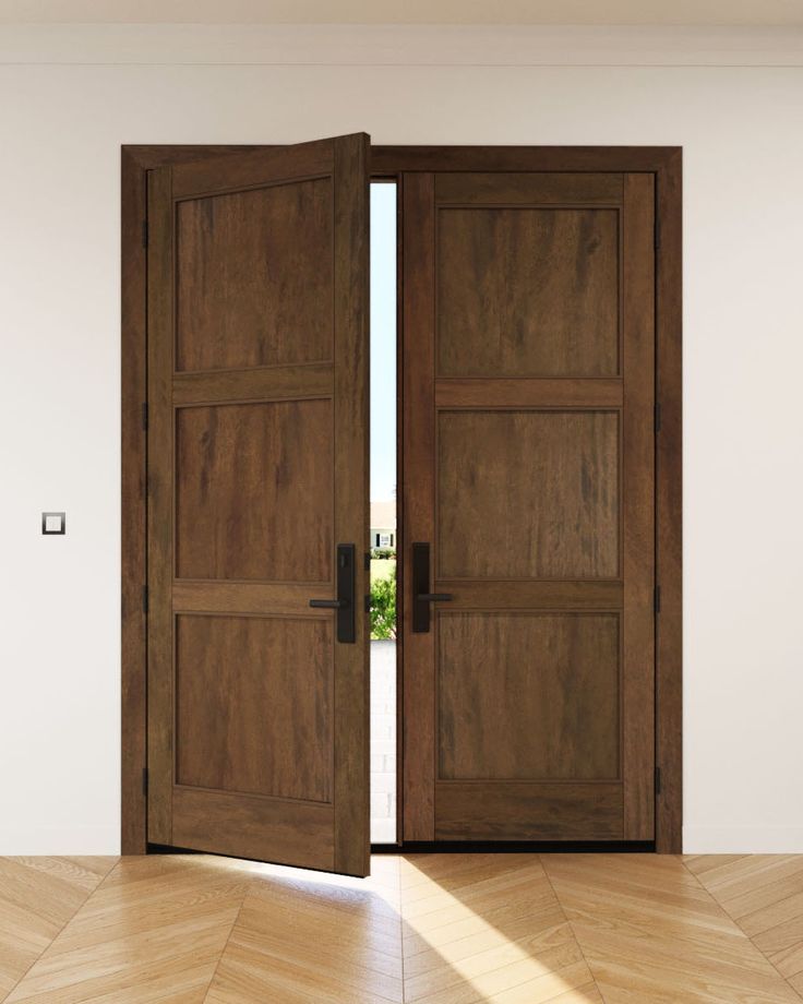 two wooden doors open in an empty room with parquet flooring and white walls