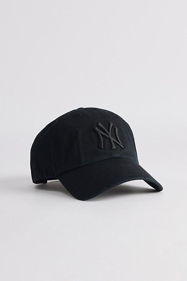 Cotton baseball cap by '47 Brand. Structured 6-panel fabrication and topped with a New York Yankees logo to the front. Includes an adjustable closure at the back and finished with a curved brim. Features '47 Brand New York Yankees MLB classic clean up hat Paneled cotton cap New York Yankees logo embroidery Adjustable strap closure Content + Care 100% Cotton Spot clean Imported Size + Fit Adjustable circumference | '47 Brand MLB New York Yankees Classic Clean Up Hat in Pitch black, Men's at Urban Outfitters Baseball Cap Boy, New York Yankee Hat, New York Yankees Logo, Yankees Cap, Yankees Hat, Mens Hats Baseball, Xmas Wishlist, Yankees Logo, Black Clothes