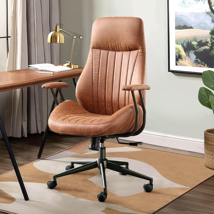 an office chair sitting on top of a rug next to a desk with a potted plant