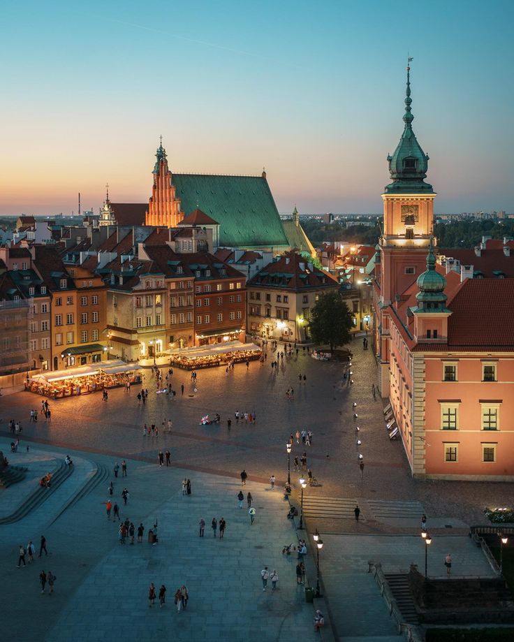 an aerial view of a city square at dusk