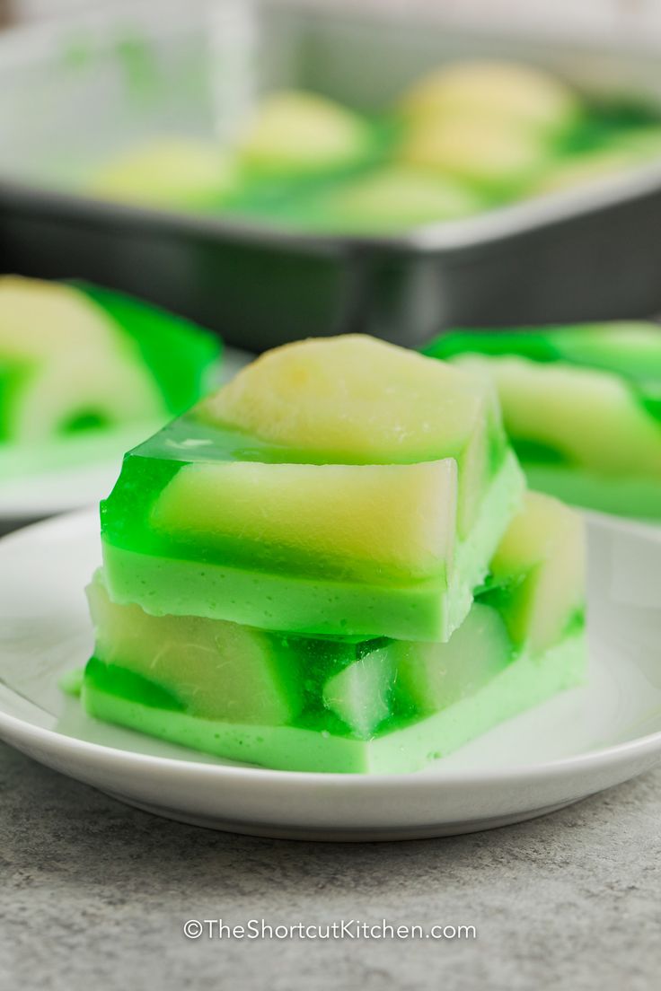 pieces of green jello on a white plate