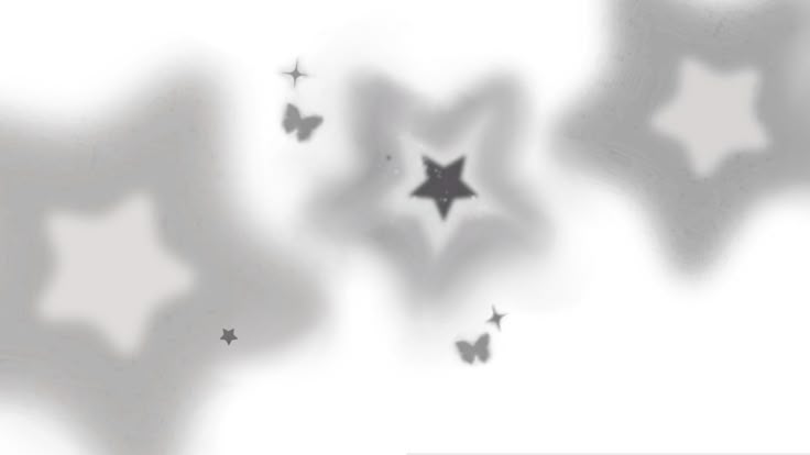 several stars are flying in the air and casting shadows on white paper with black ink