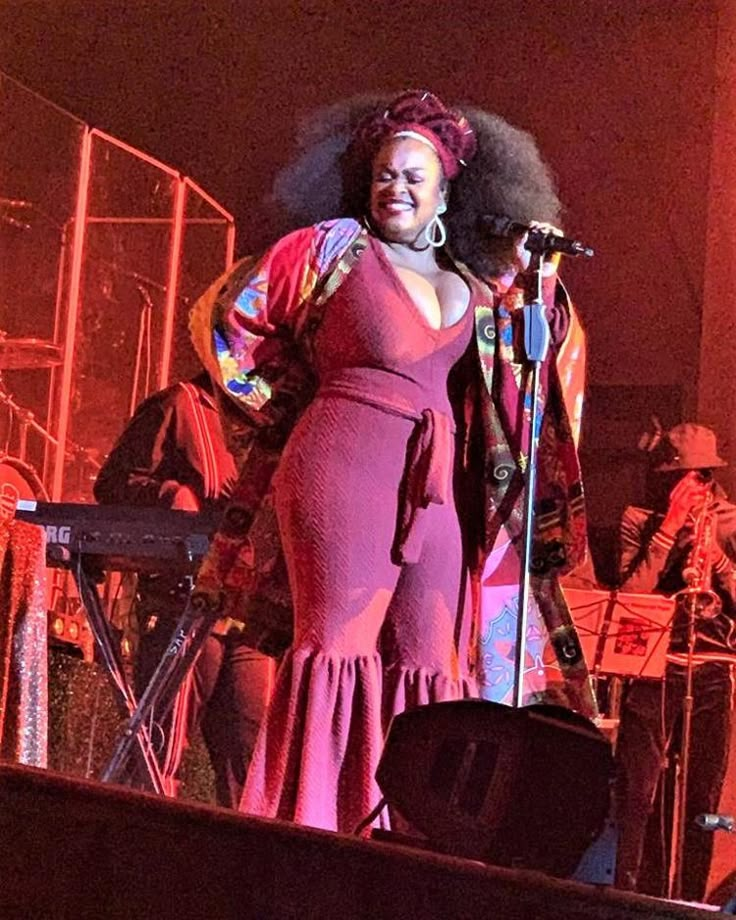 a woman standing on top of a stage