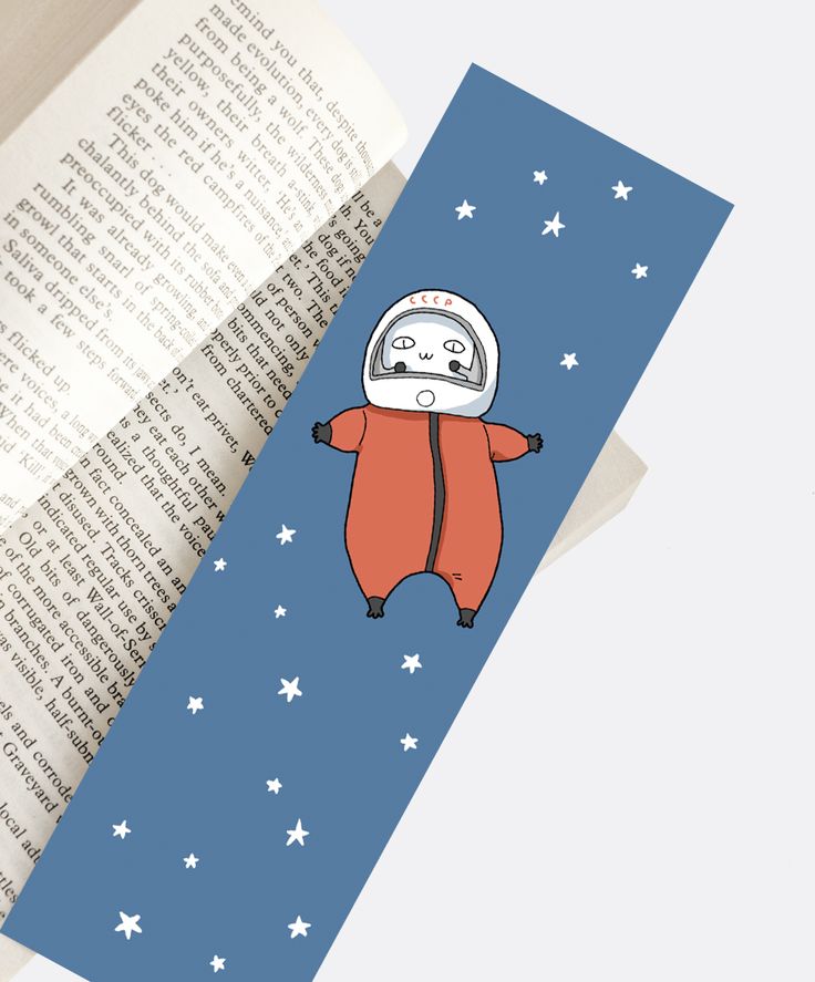 a bookmark with an image of a bear wearing a space suit and stars on it