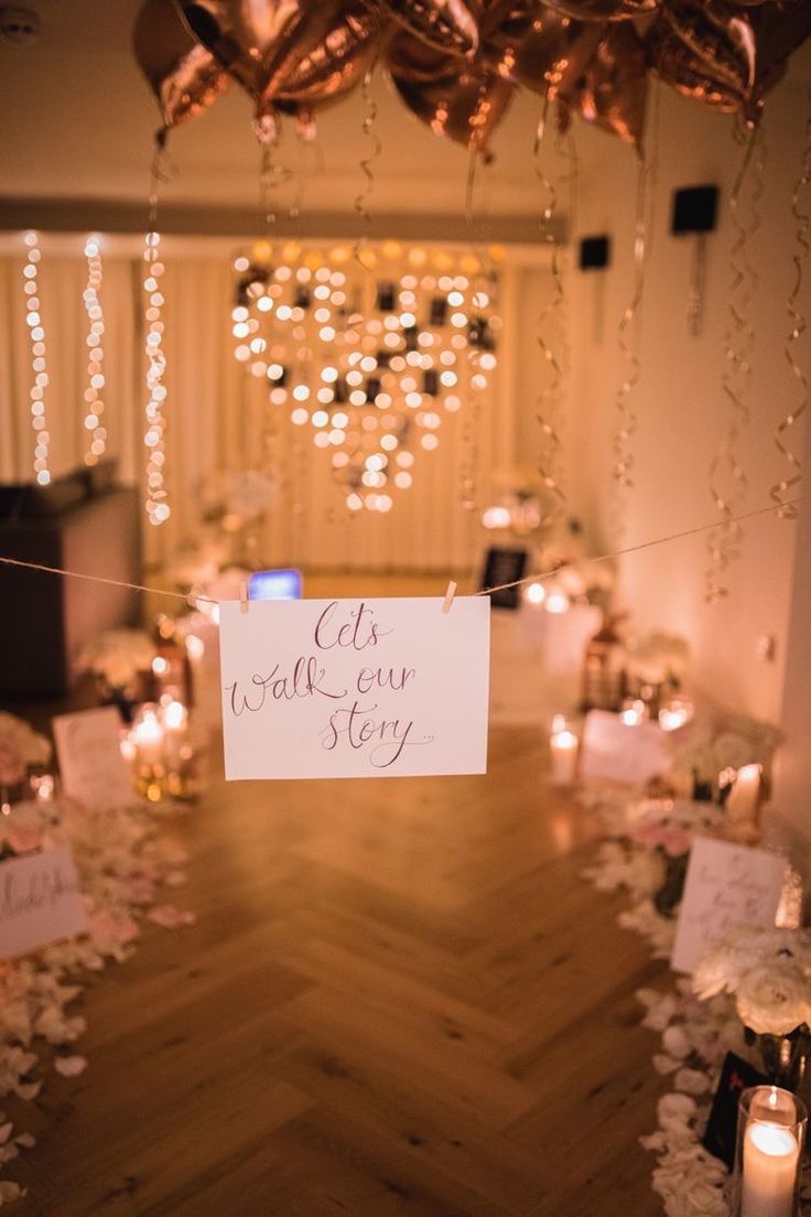 a sign that says let's make our story on it in front of some candles