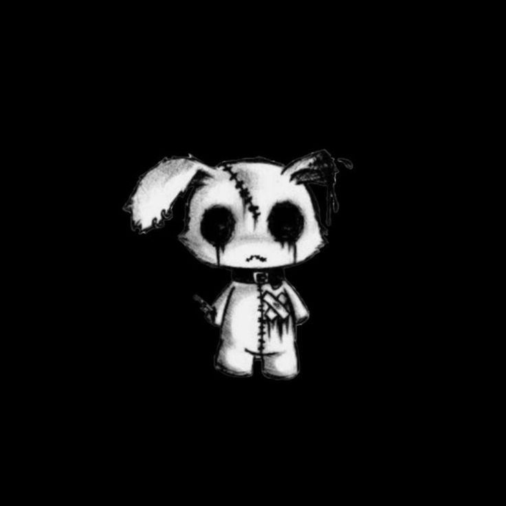 a black and white photo of a small animal with big eyes on it's face