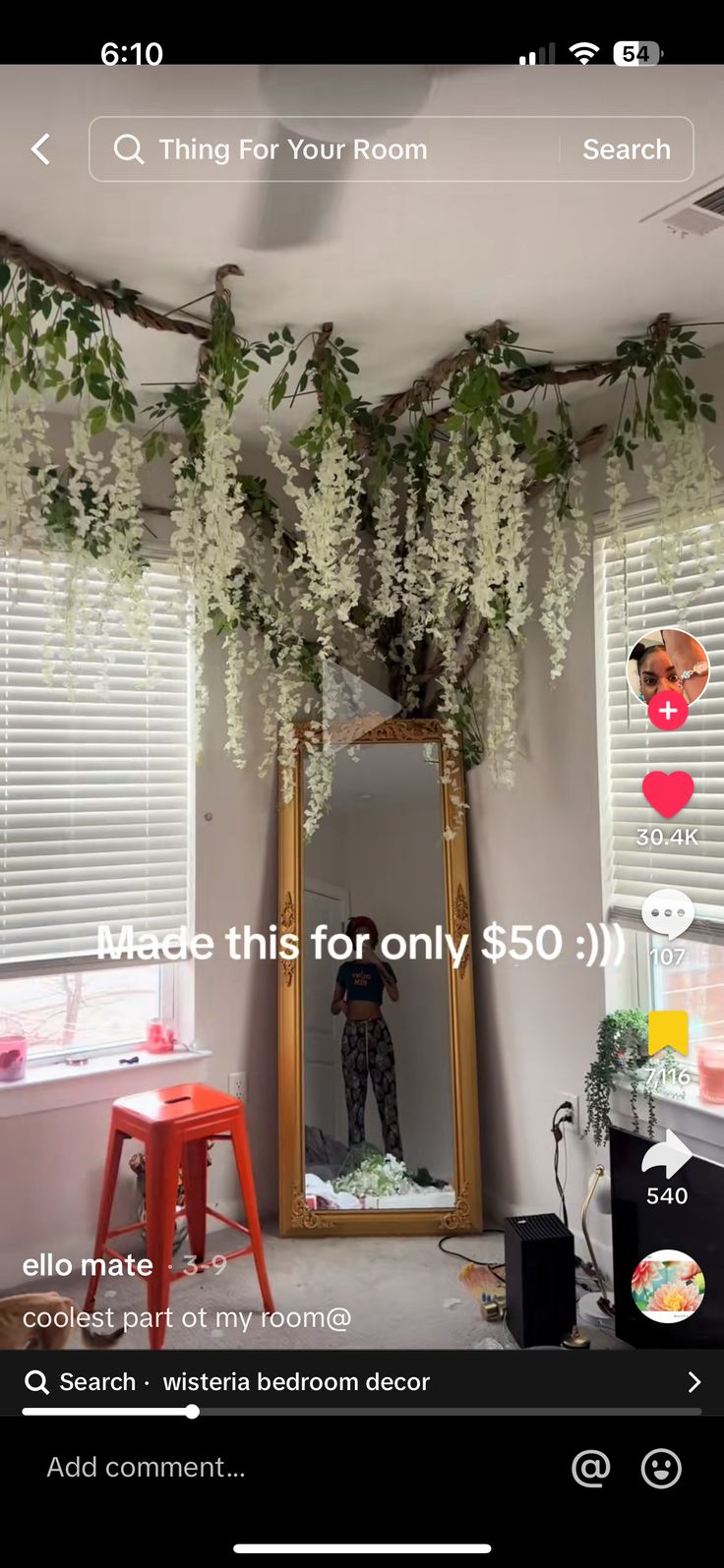 an image of a room with flowers on the ceiling and a mirror in the corner