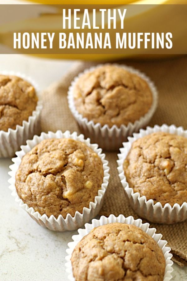 healthy honey banana muffins on a table with bananas in the background and text overlay