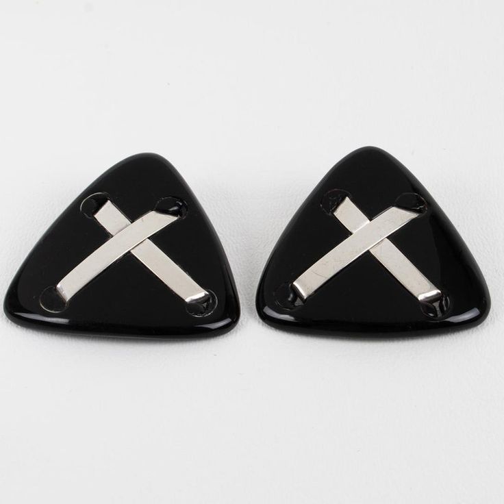 Anne and Frank Vigneri designed these lovely Lucite clip-on earrings in the 1980s. The geometric triangle design features a black Lucite element, topped with sterling silver crossed bands. The earrings are unsigned, but the special French clip-back is an unmistakable brand signature. Good condition, with minor wear on the metal, but nothing obvious, and some oxidation on the fastenings. Measurements: 2 in wide (5 cm) x 1.82 in high (4.6 cm).  Please see the measurements noted above in the descri French Clip, Triangle Design, Geometric Triangle, Sterling Silver Cross, Clip On Earrings, Band, Sterling Silver, Silver, How To Wear