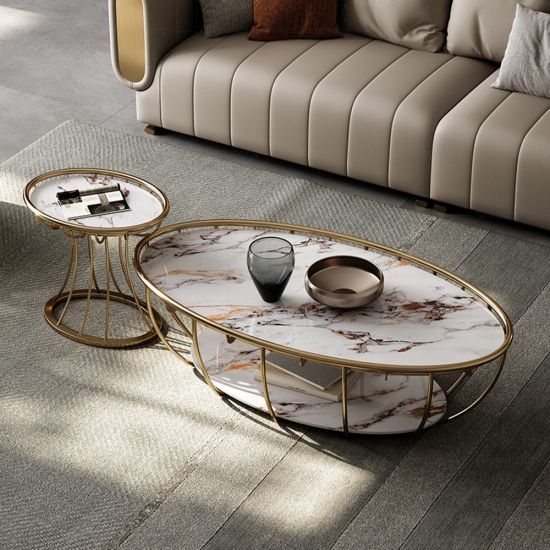 a marble coffee table sitting on top of a wooden floor next to a beige couch