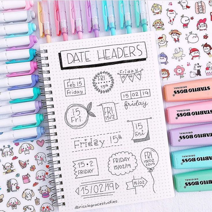 a notebook with stickers and pens on it next to some other planner pages that are lined up