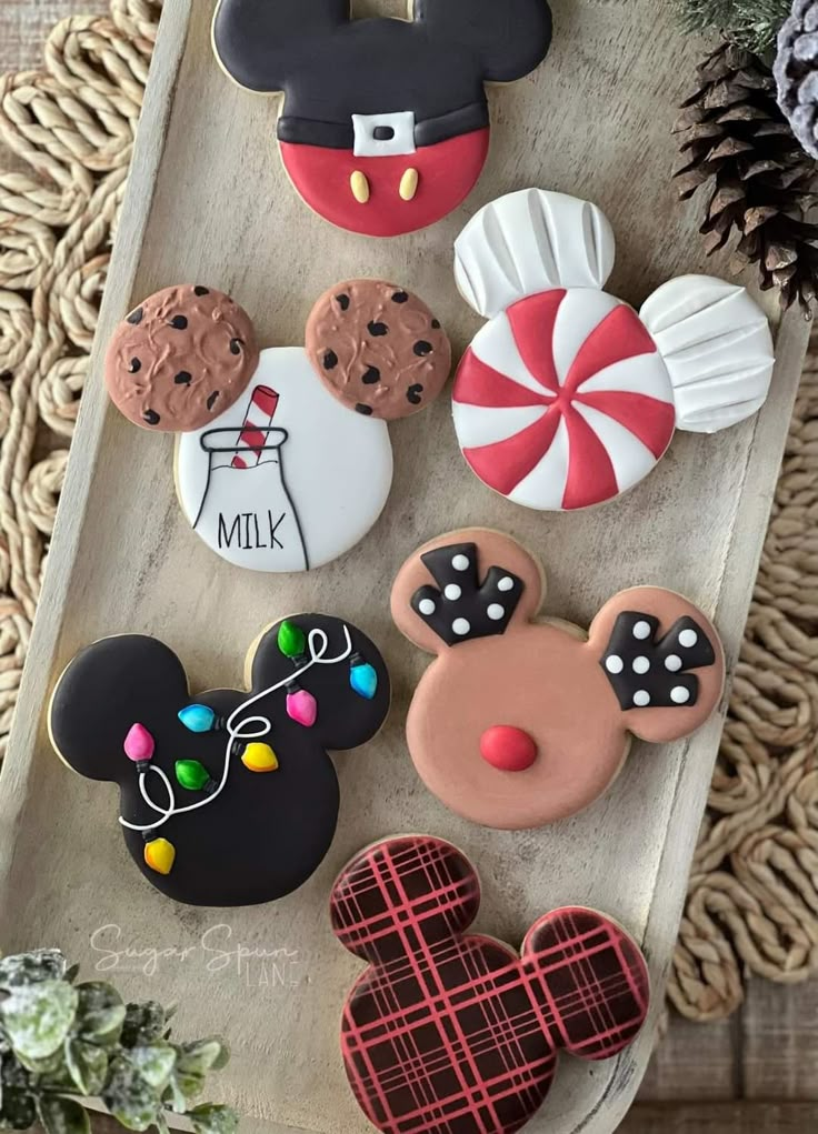 mickey mouse and minnie mouse cookies on a tray