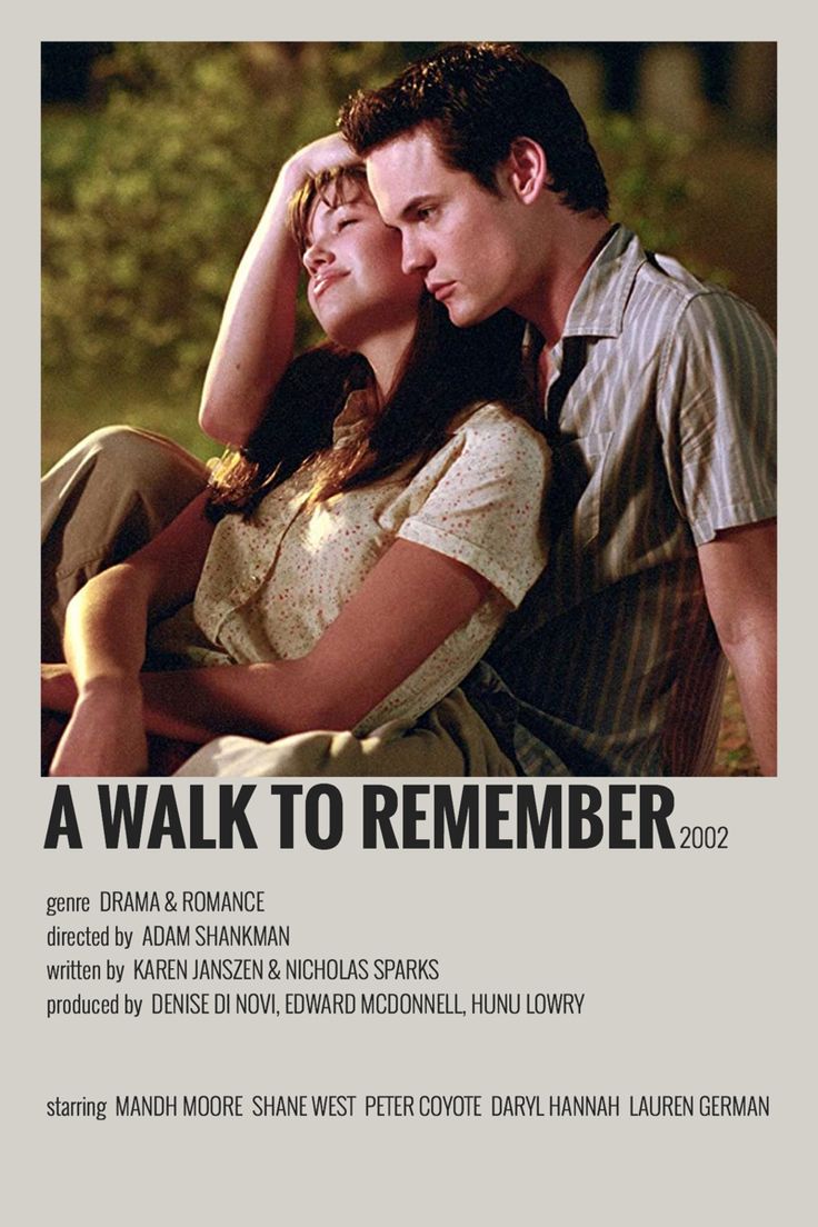 a man and woman sitting next to each other on top of a poster with the words a walk to remember