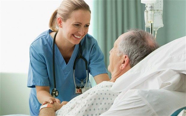 a nurse is talking to an elderly man in a hospital bed with the caption medical tourism india la amitie india