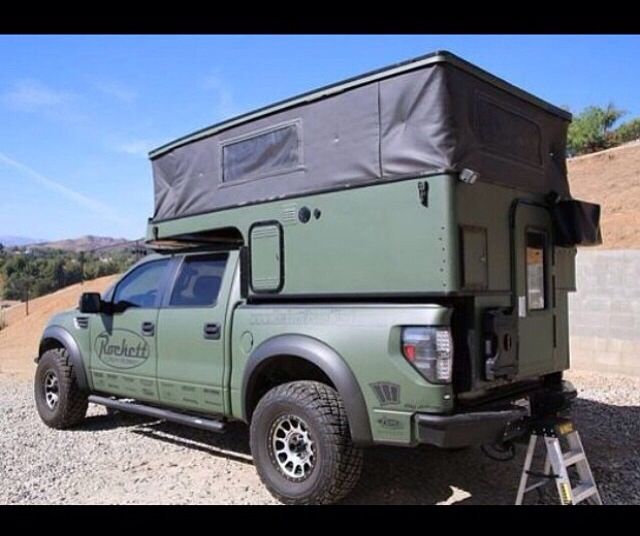 a truck with a camper attached to the back