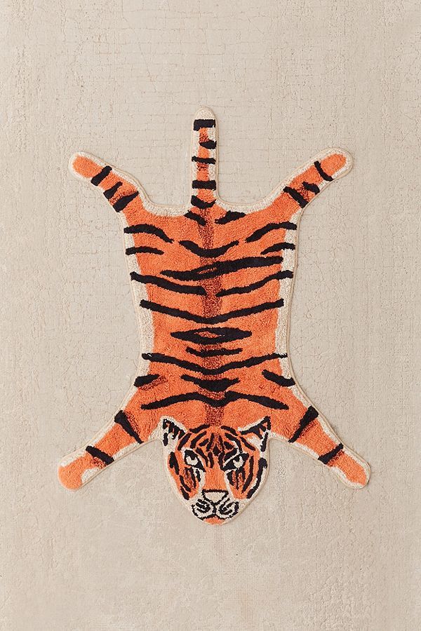 an orange and black tiger on a white background with the image of a man made out of it