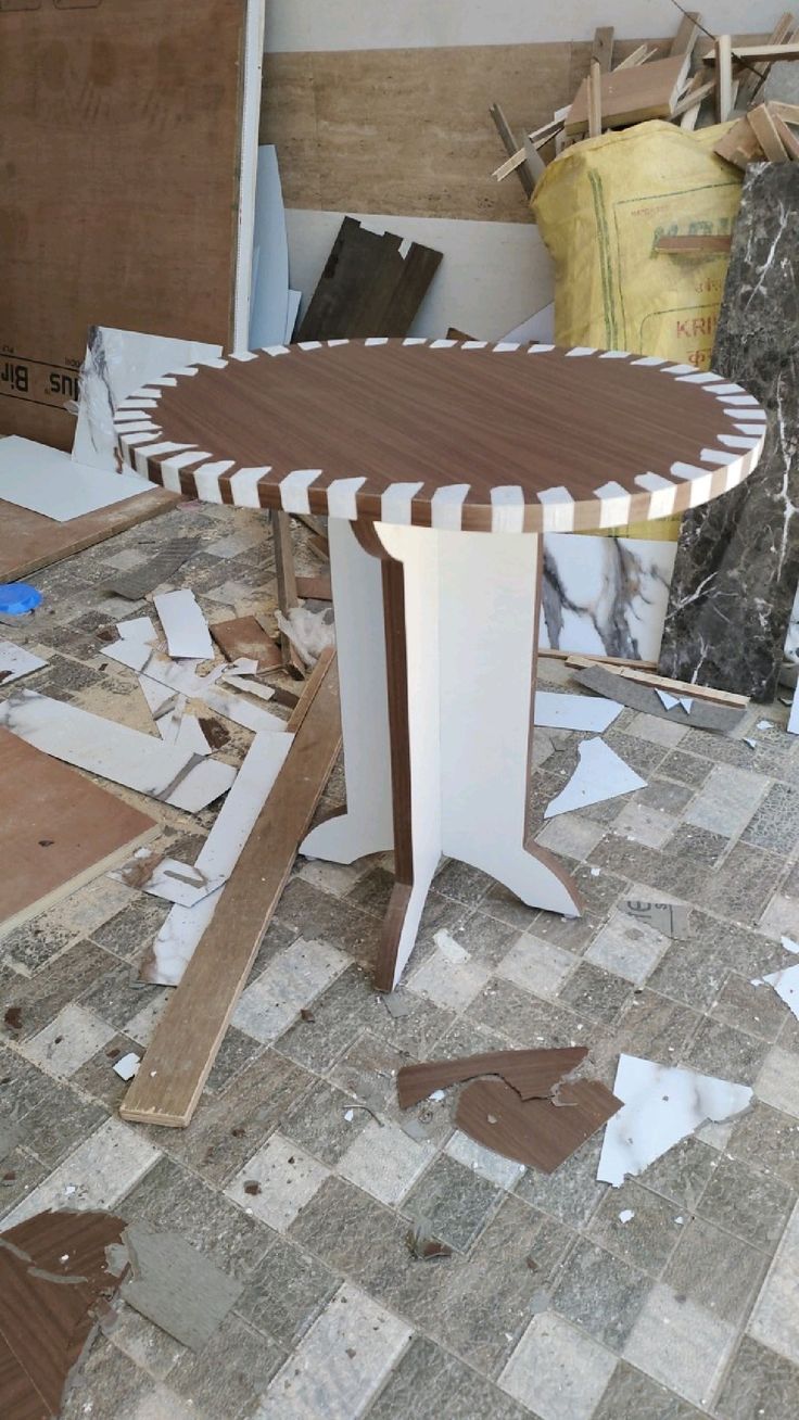 a table that has been cut into pieces and is sitting in the middle of a room