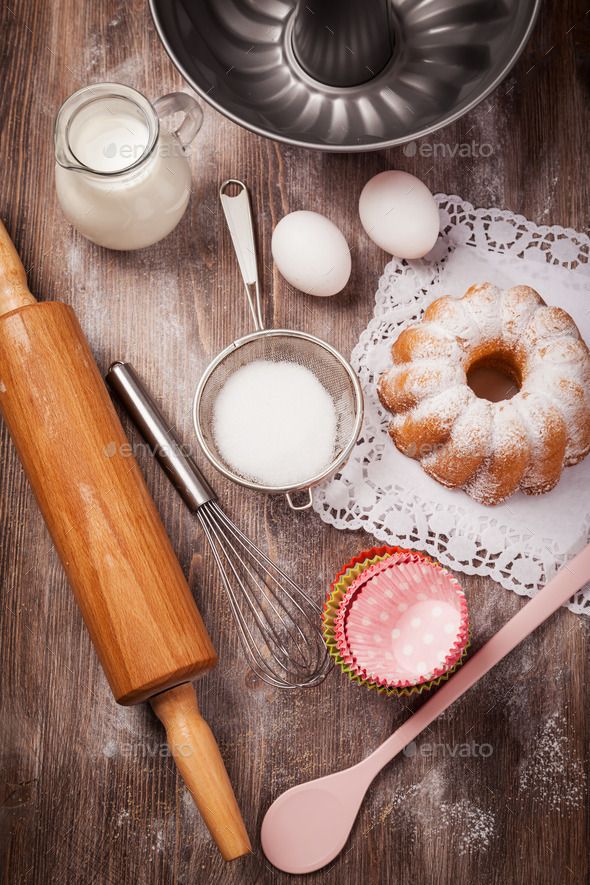 doughnuts and other ingredients on a wooden table